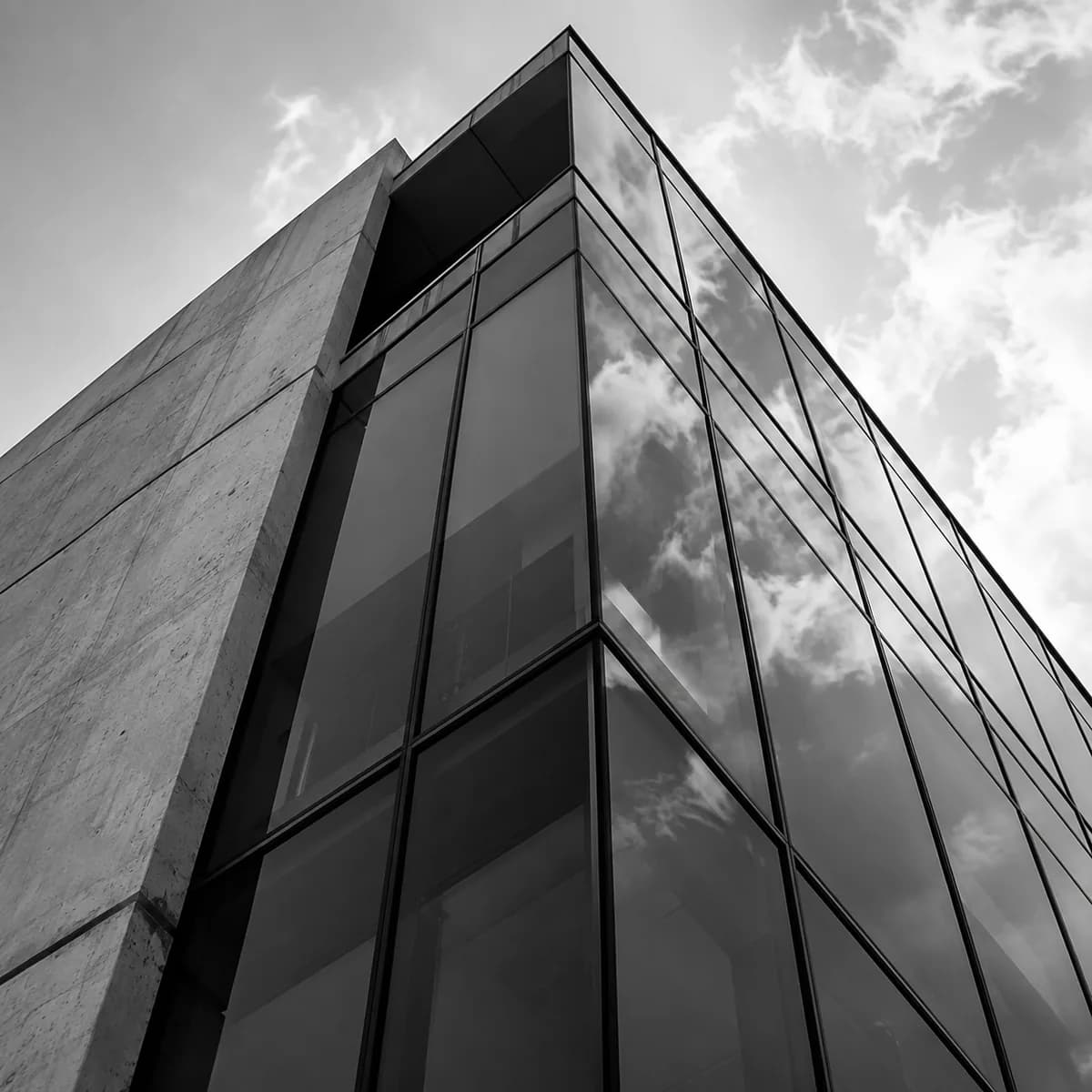 The glass and concrete façade of an office building.
